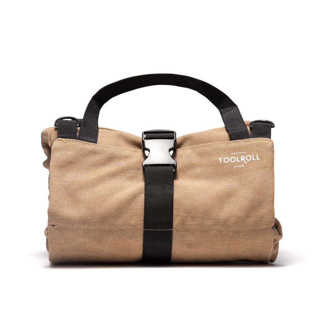 Picture of the front of a khaki tool roll by Official Tool Roll